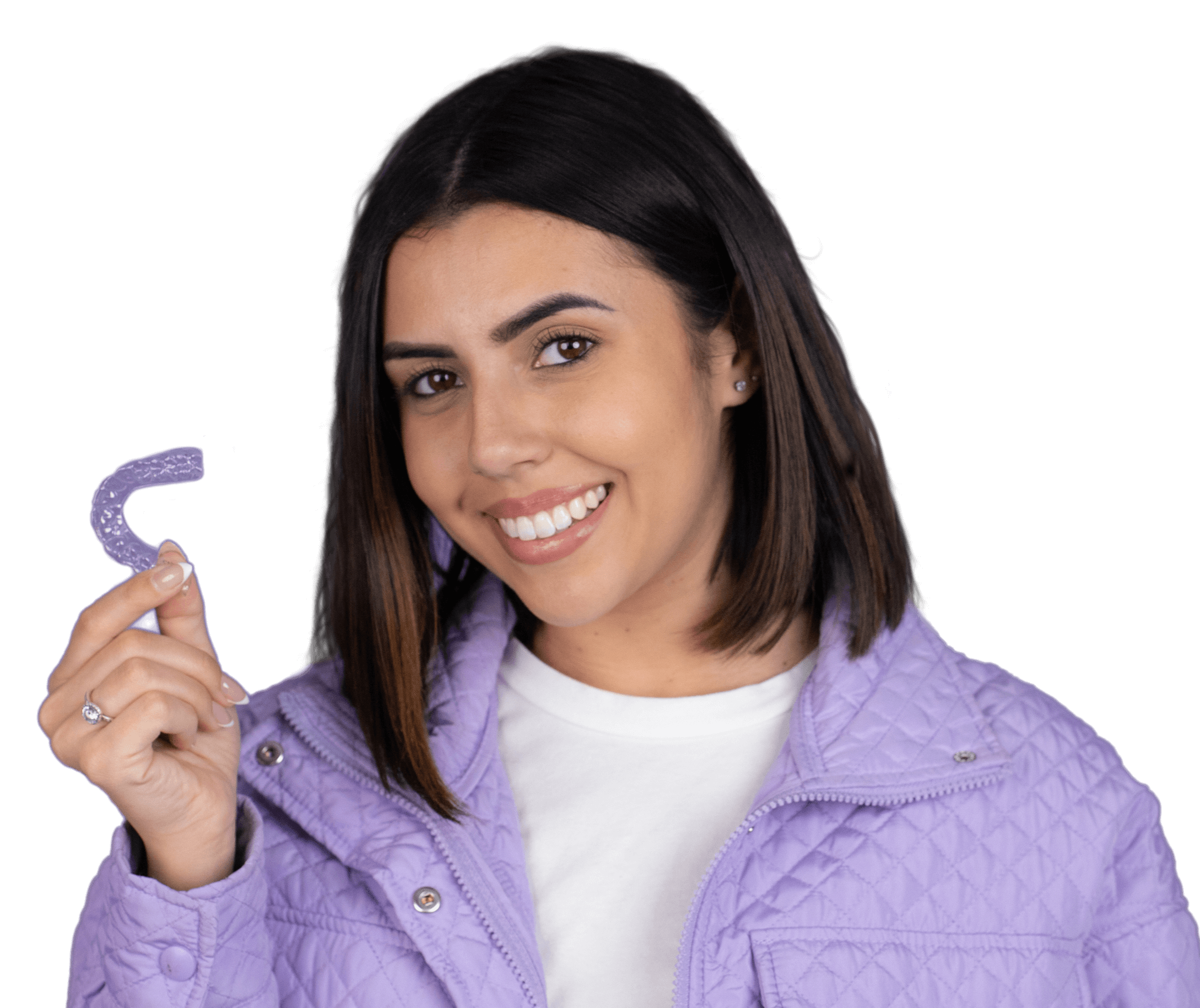 Young woman smiling and holding Virtuoso clear aligners